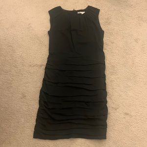Flattering black dress with gold zipper up the back
